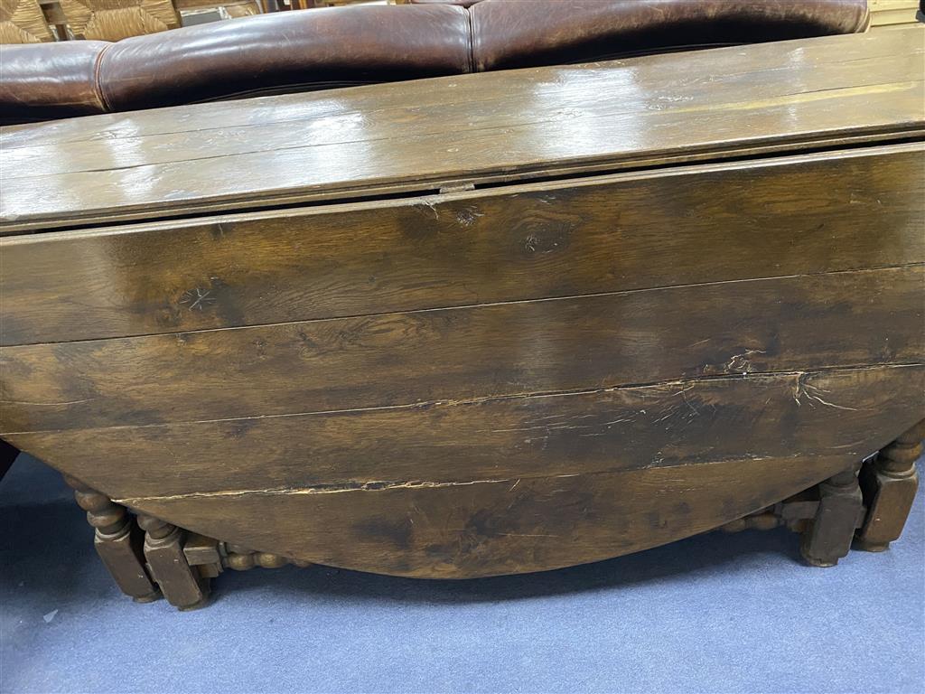 An 18th century and later oak bobbin leg gateleg dining table, length 170cm extended, width 162cm, height 76cm